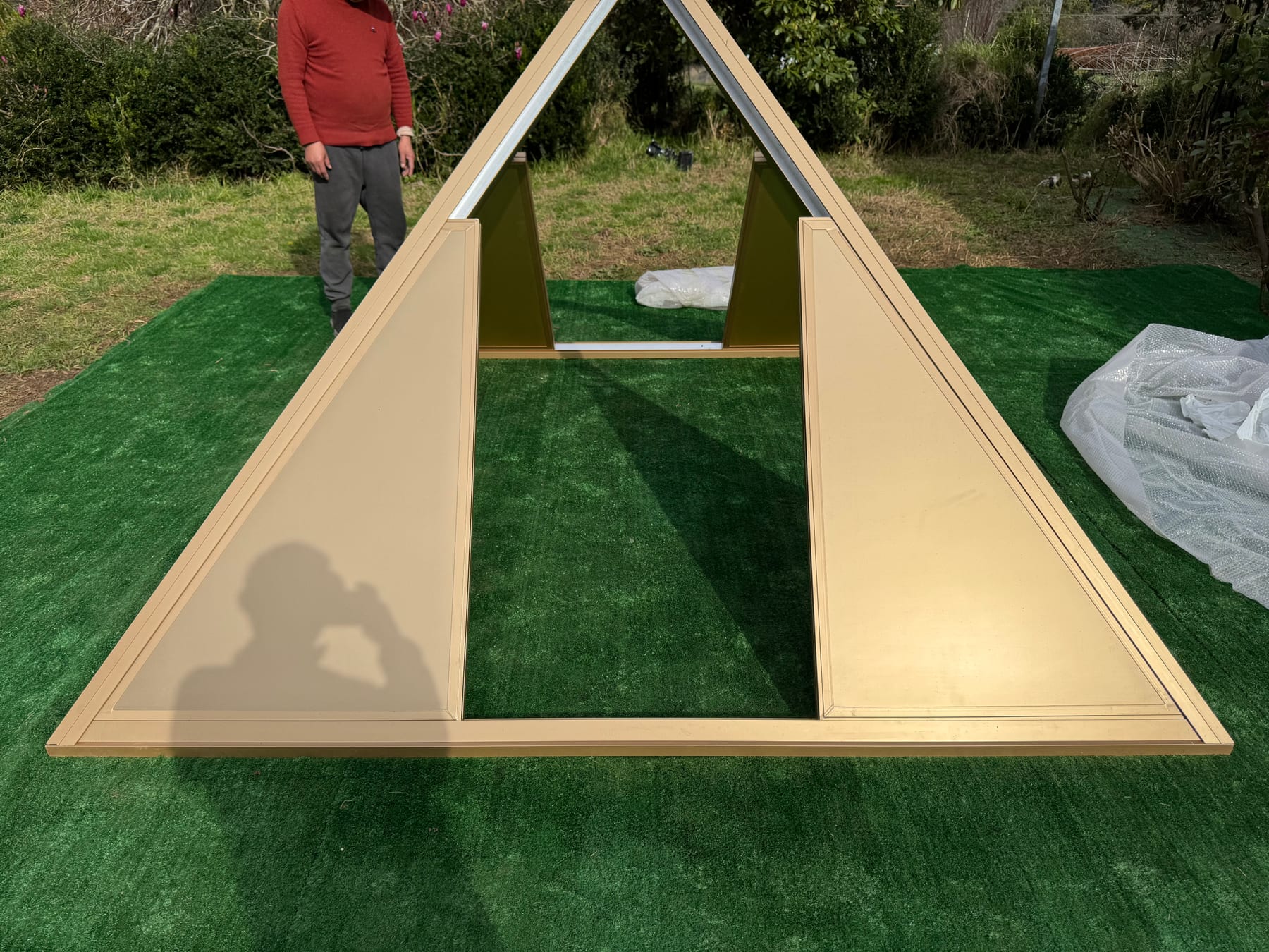 Panels being fitted to the pyramid frame