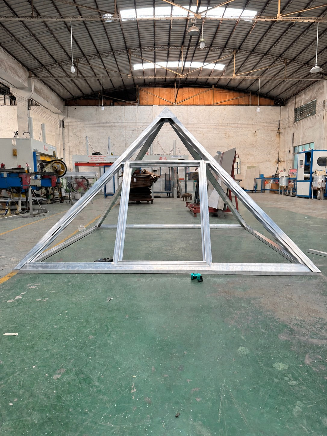 Pyramid development frame in the workshop; people removed from the original photograph